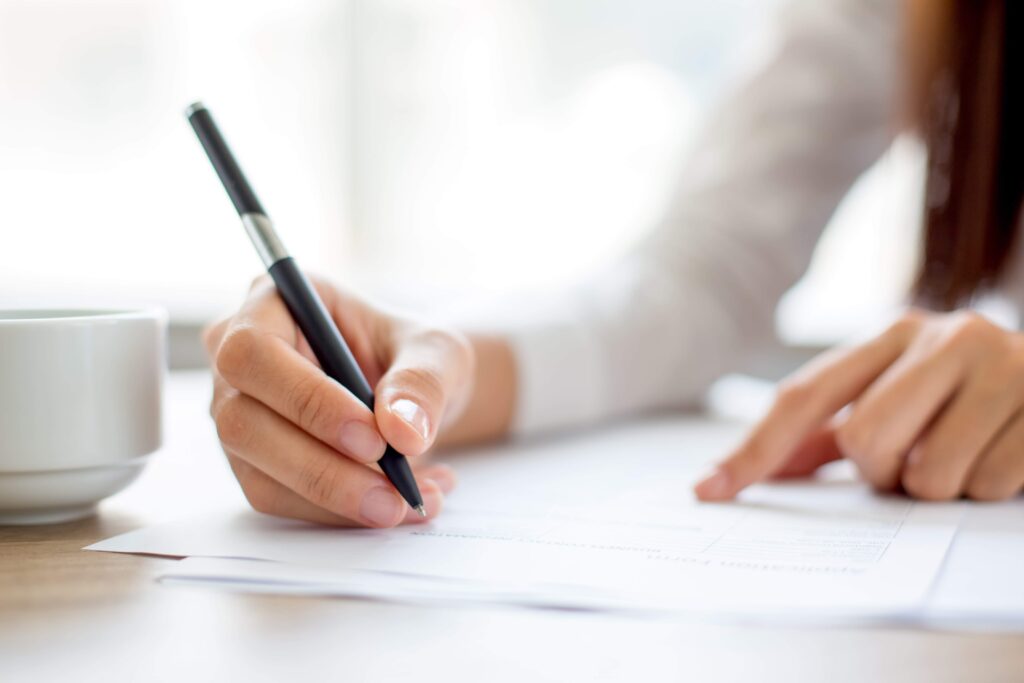 Woman taking the written part of one of the most popular Danish exams.