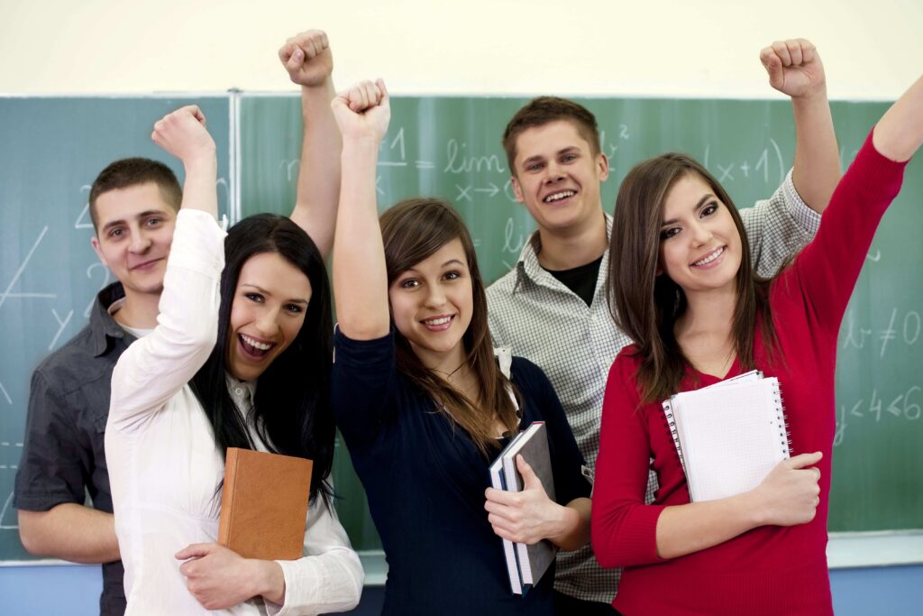 Group of young students happy after passing their Danish exams.