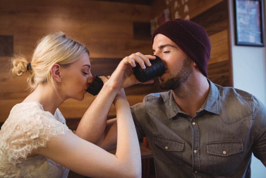 Couple drinking sake and using the Japanese phrase "Kampai!"