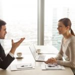 man and woman talking in a foreign language