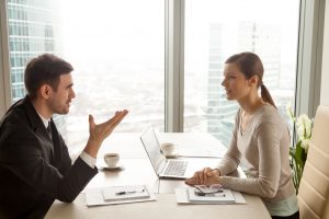 man and woman talking in a foreign language