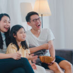 asian-family-enjoy-their-free-time-relax-together-home-lifestyle-dad-mom-daughter-watch-tv-together-living-room-modern-home-night-150x150.jpg