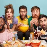 multiethnic-funny-companions-eat-popcorn-watch-horror-film-have-gaze-with-interest-express-surprisement-being-scared-frigthened-isolated-blue-wall-seated-comfortable-sofa-min-1-150x150.jpg