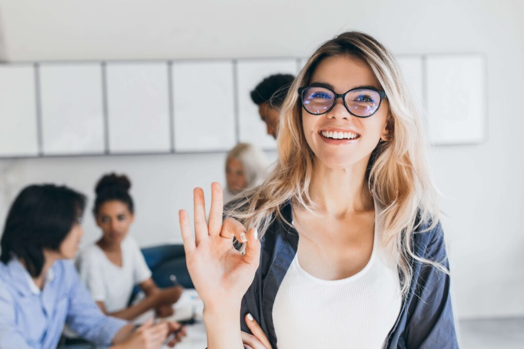 Female English student doing the OK sign