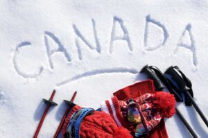 "Canada" written on the snow. Visiting this country is one of the reasons why French is important.